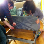 Ed and Vanessa finishing reassemble the piano bench