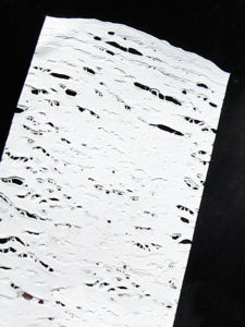 This fused plastic was ironed a little longer, giving it an interesting holey texture.