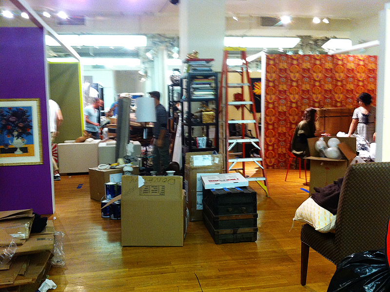 Packing materials, boxes, furniture, and decorative accessories continued through all the aisles.